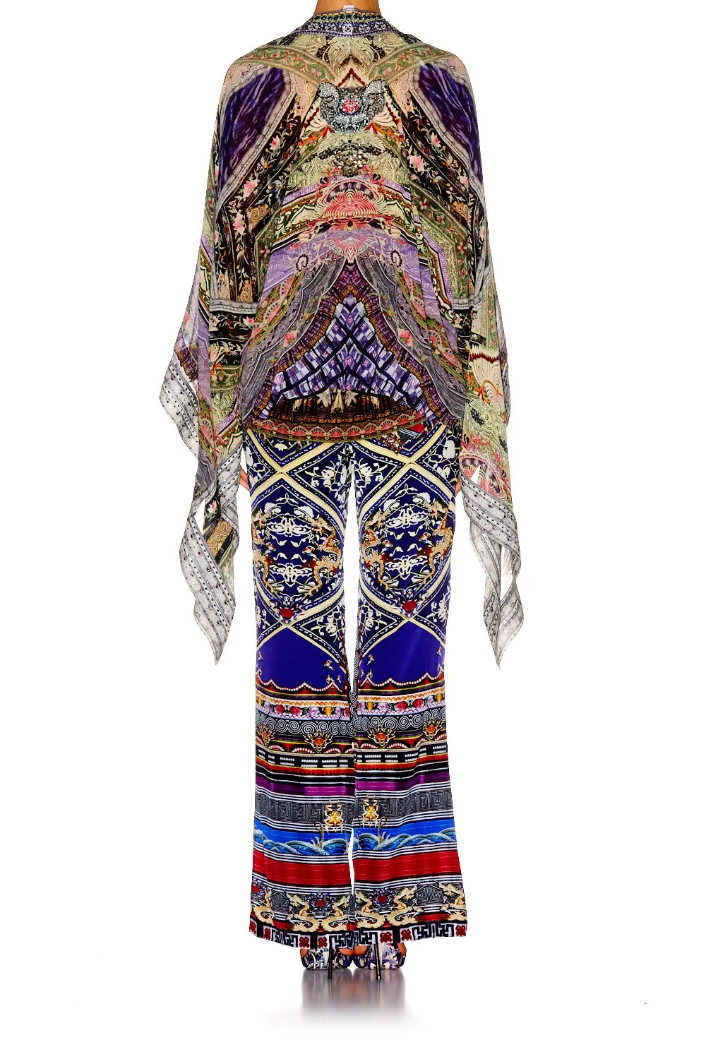 LAYERING PIECE WITH HIGH LOW HEM THREADS THAT BIND US